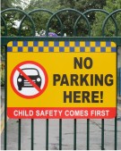 School Sign on Railings