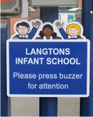 School Sign on Railings