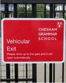School Sign on Railings